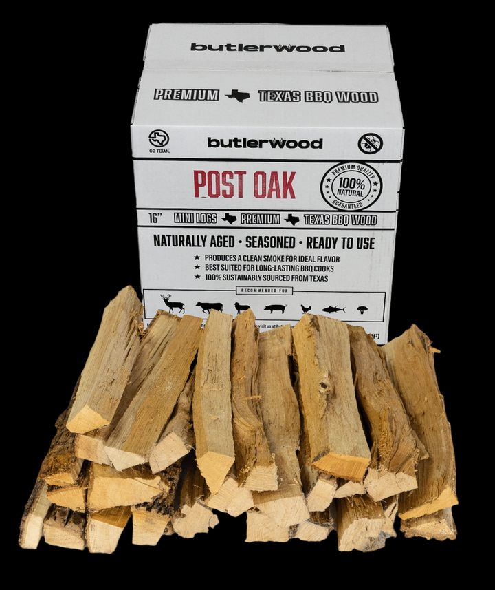 Large split post oak cooking wood logs stacked for smoking and grilling.