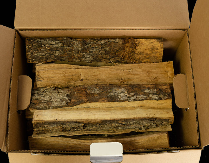 Stacked post oak cooking wood logs, perfect for grilling, barbecuing, and smoking meats.