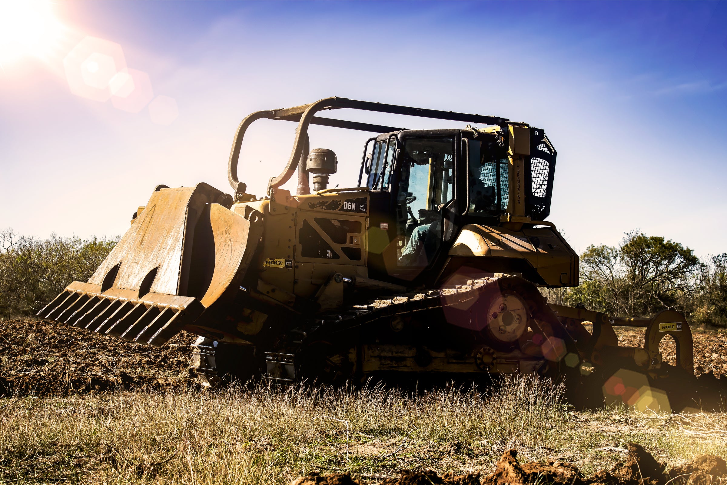 Land Clearing machinery in an open field.