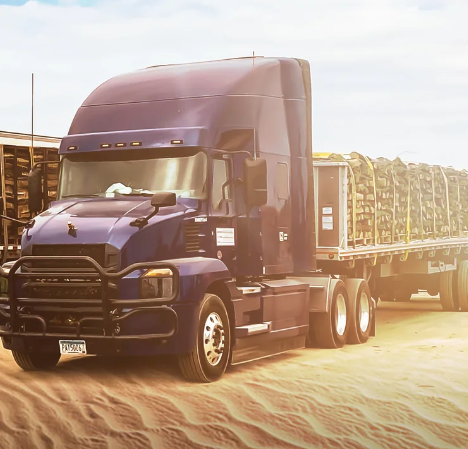 Purple semi-truck  carrying stacks of firewood on a dirt road with a clear sky